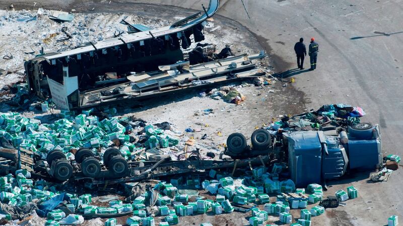Emergency personnel work at the scene of the fatal crash outside of Tisdale, Saskatchewan, Canada. Photograph: Jonathan Hayward/The Canadian Press via AP