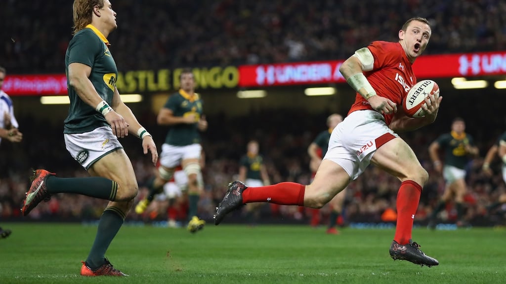 Hadleigh Parkes of Wales stretches clear of South Africa’s Andries Coetzee to score his side’s third try. Photograph: Getty Images