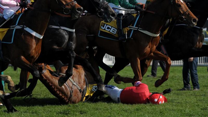 Ruby Walsh falls from Abbyssial, suffering an arm injury in the process. Photograph: Tim Ireland/PA Wire
