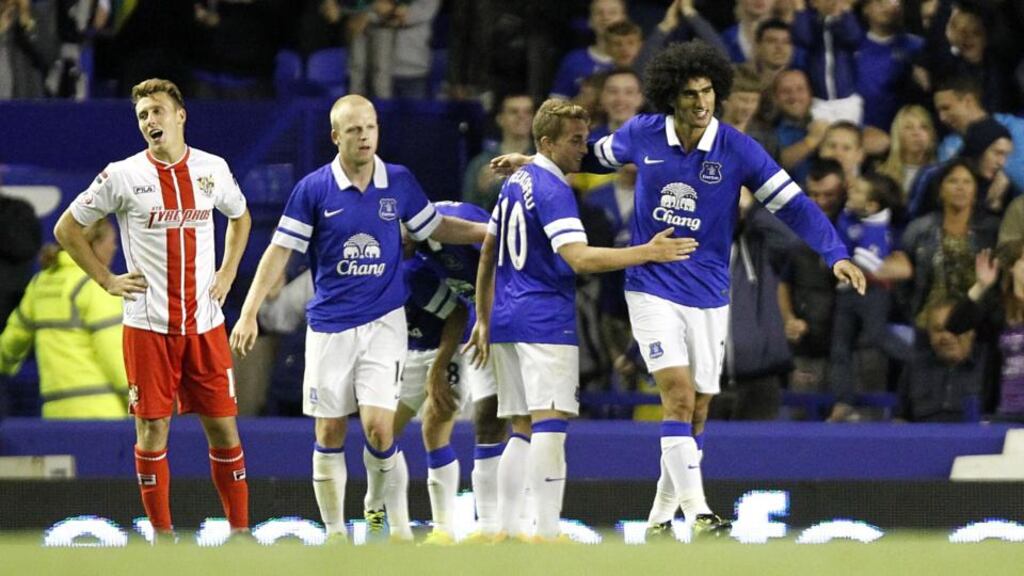 Everton’s Marouane Fellaini celebrates scoring his side’s winning goal in extra time in the Capital One Cup game against Stevenage at Goodison Park. Photograph: Peter Byrne/PA