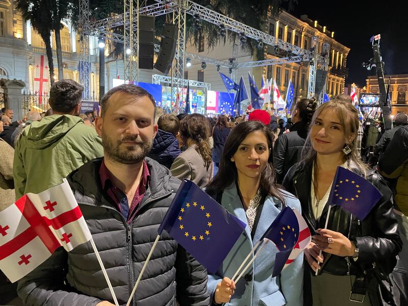 Tbilisi residents Tamaz Akhobadze, Nino Okroadze and Tamar Gogichadze at a rally in favour of Georgia's EU membership on Wednesday night. Photograph: Daniel McLaughlin