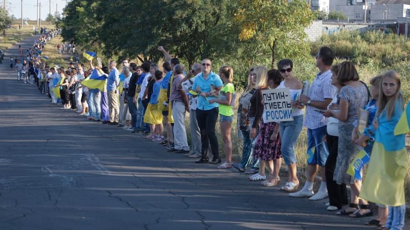 Inhabitants of Mariupol form a human chain in support of Independent Ukraine and against war on the eastern side of Mariupol in the Donetsk region yesterday. Photograph: Alexander Ermochenko/EPA