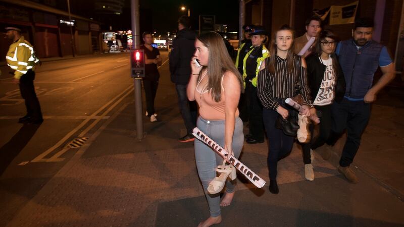 Concert goers react after fleeing the Manchester Arena where Ariana Grande had been performing. Photograph: Jon Super/Reuters