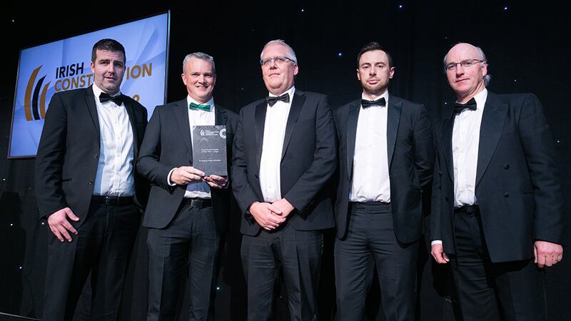 Darragh Coleman, managing director, Williaam Cox, presents the Commercial Project of the Year – Large award to the PJ Hegarty team.