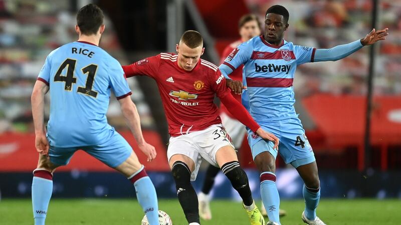 West Ham’s Irish teenage striker Ademipo Odubeko challenges Manchester United’s Scott McTominay during the FA Cup fifth-round match at Old Trafford. Photograph: Michael Regan/Getty Images