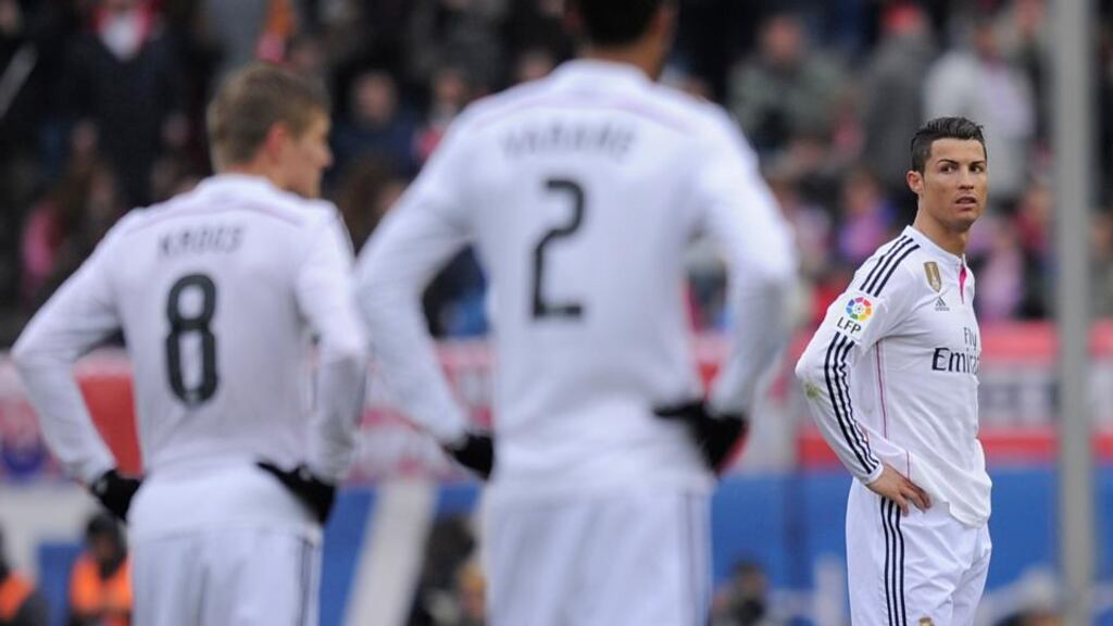 Cristiano Ronaldo (right) of Real Madrid after Atletico Madrid scored their third goal at Vicente Calderon Stadium. Photograph: Denis Doyle/Getty Images