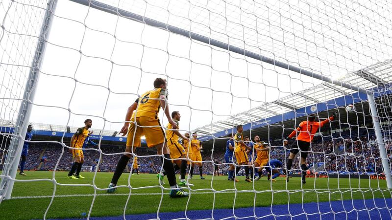 Harry Maguire scores for Leicester. Photograph: Darren Staples/Inpho