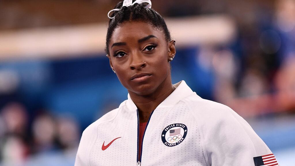 Simone Biles waits for the final results of the artistic gymnastics women’s team final. Photograph: Loic Venance/Getty/AFP