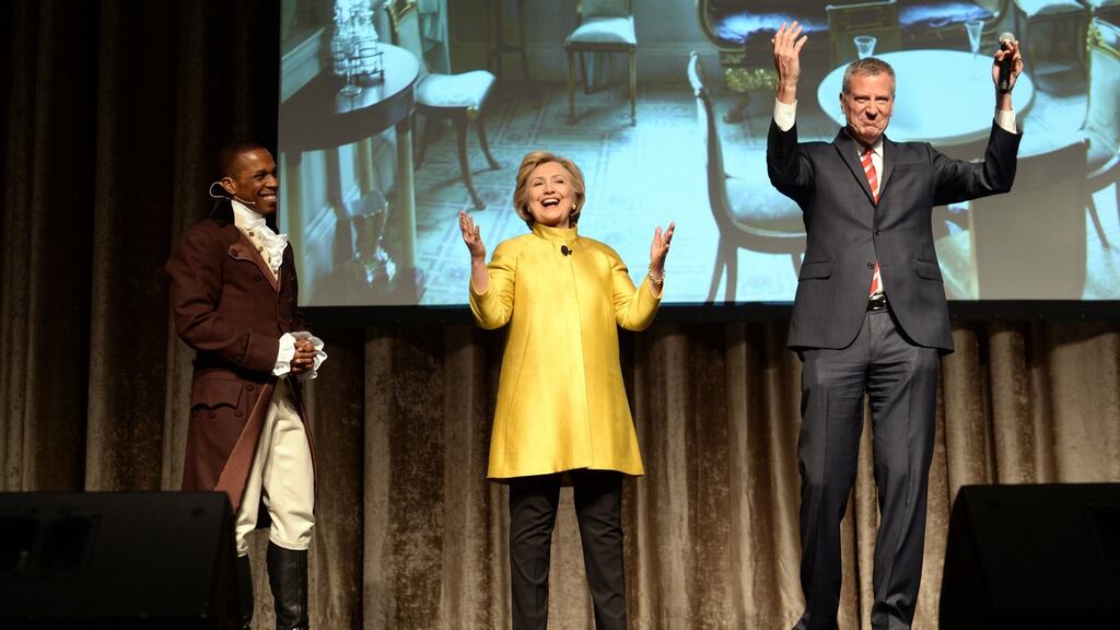 Leslie Odum jnr, from the Broadway musical Hamilton, presidential candidate Hillary Clinton, and New York mayor Bill de Blasio perform at the 94th annual Inner Circle Dinner on Saturday. Photograph: David Handschuh/The Inner Circle Via AP