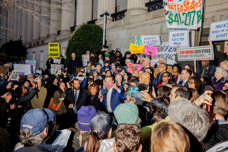 Senator Chris Murphy speaks during a protest against the department of government efficiency, outside the treasury department in Washington. Photograph: Jason Andrew/New York Times