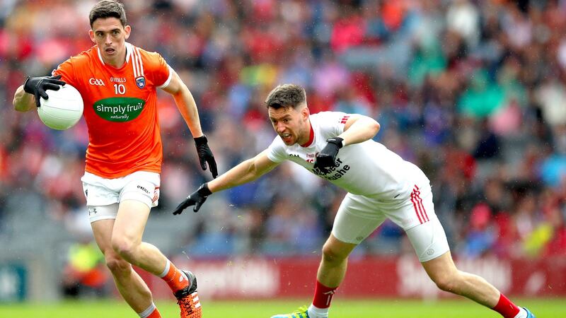 Armagh’s Rory Grugan gets away from Matthew Donnelly of Tyrone during the All-Ireland SFC quarter-final at Croke Park. Photograph: James Crombie/Inpho