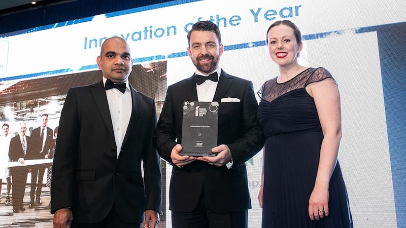 Graham Doyle, General Manager, Watson-Marlow Ireland presents the Innovation of the Year award to Rajesh Narayanan & Barbara Wood, APC.
