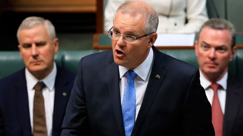 Australia’s prime minister Scott Morrison (centre) delivers a national apology to child sex abuse victims in the House of Representatives in Parliament House, Canberra, on Monday. Photograph: Sean Davey/AFP/Getty Images