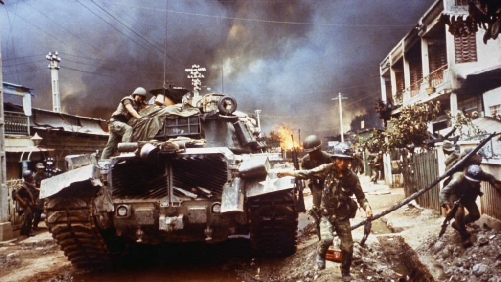 Vietnamese rangers move up a street in Cholon. Photograph: Bettmann Archive