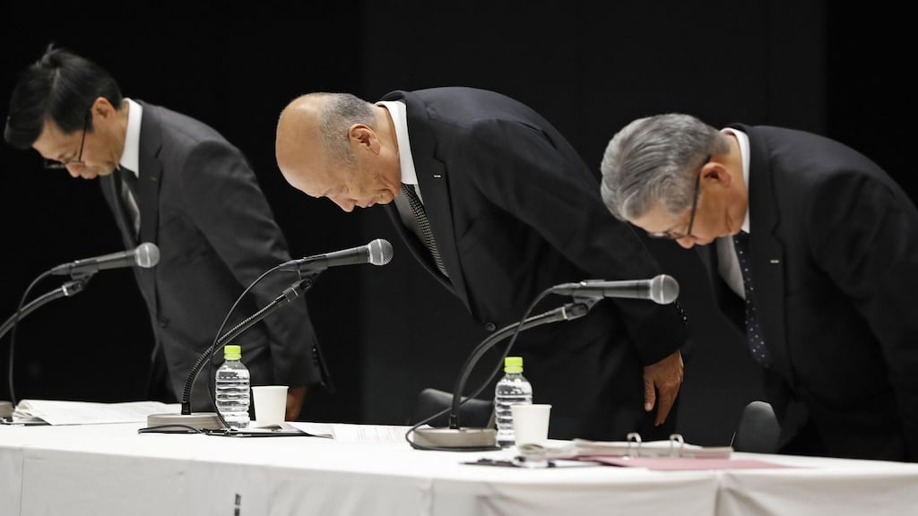 Tadashi Ishii (centre), president of Japanese advertising company Dentsu, will step down over the suicide of a worker who had clocked massive overtime.