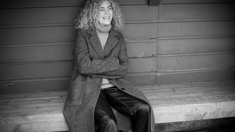 Double-face tweed wool coat €149, grey cashmere-mix polo sweater €79, leather trousers €159