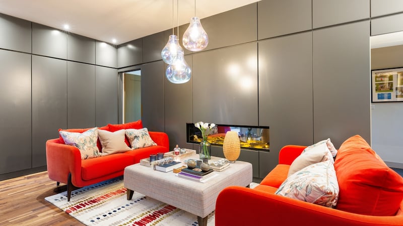 Interior seating area with grey panelled walls.