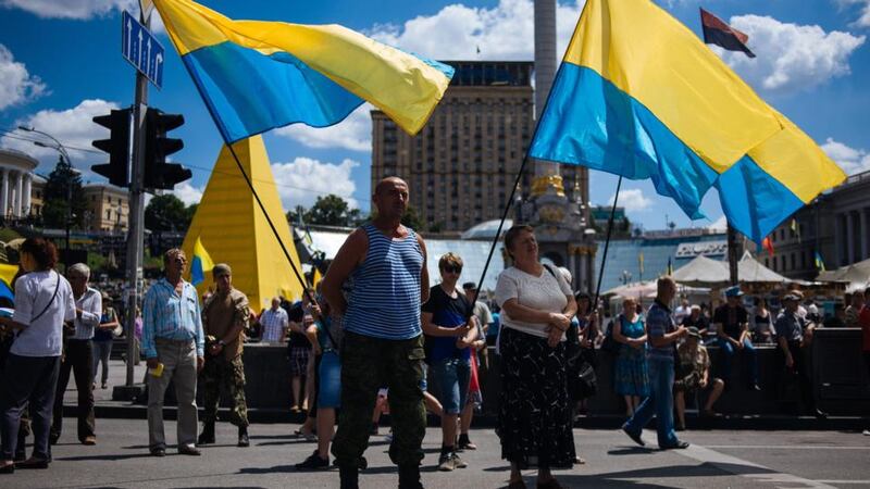Pro-Ukrainians hold their national flags during a mass meeting on Independence Square in Kiev today. Photograph: Roman Pilipey/EPA