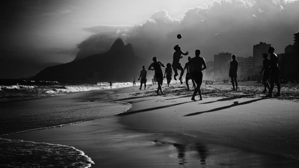 Locals while away the hours on Rio’s Ipanema Beach before the start of the greatest sports show on earth tomorrow. Photograph: Getty Images