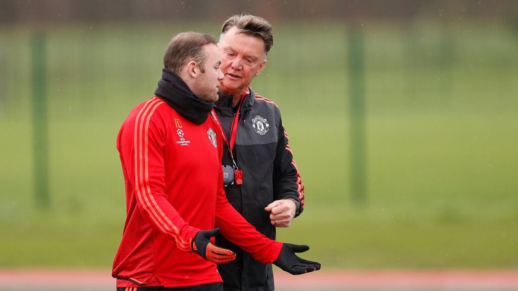 Manchester United’s Wayne Rooney and manager Louis van Gaal speak during squad training. Photograph: Carl Recine/Reuters