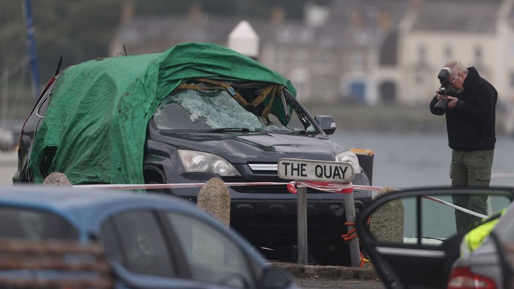 A car is examined after it entered the water at the harbour in Strangford, Co Down.  Photograph: Liam McBurney/PA Wire