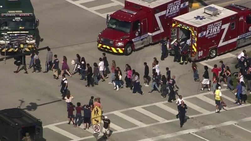 Students are evacuated from Marjory Stoneman Douglas High School during a shooting incident in Parkland, Florida. Photograph: WSVN.com via REUTERS
