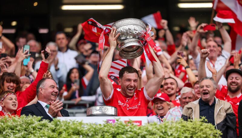 Louth's Sam Mulroy lifts the Delaney Cup after their Leinster final win over Meath. Photograph: James Crombie/Inpho