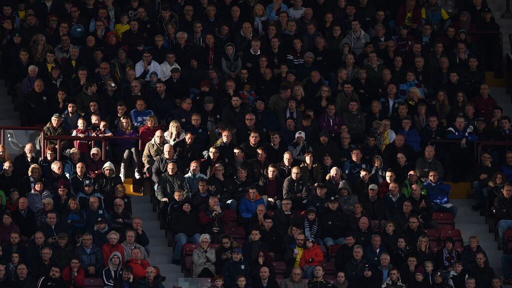 A shaft of sunlight falls on the Villa supporters during the English Premier League football match against Swansea City at Villa Park. Photograph: Getty Images
