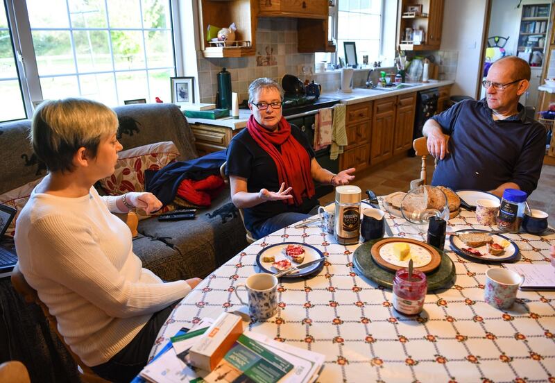 Mags Donnelly and Margaret Bevan-Hanger with Robert Armitage in his home, next to the new centre. Photograph: Diarmuid Greene