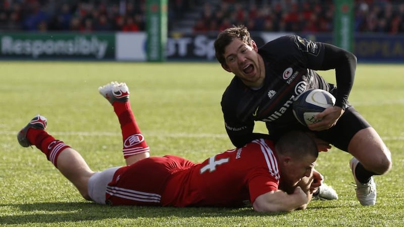 Alex Goode of Saracens is tackled by Andrew Conway of Munster at Allianz Park. Photograph: Steve Bardens/Getty Images