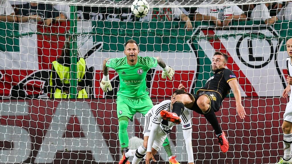 Robert Benson tries a spectacular bicycle kick during Dundalk’s 1-1 draw with Legia Warsaw. Photograph: Inpho/Tomasz Jastrzebowski