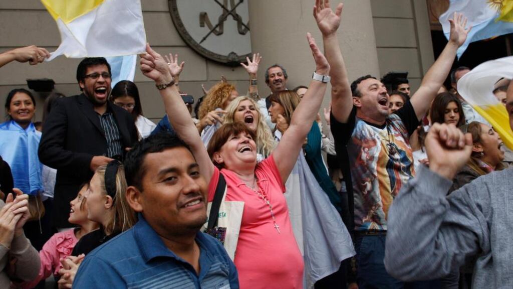 Roman Catholics celebrate the election of Cardinal Jorge Bergoglio at the Metropolitan Cathedral in Buenos Aires. Photograph: Agustin Marcarian/Reuters