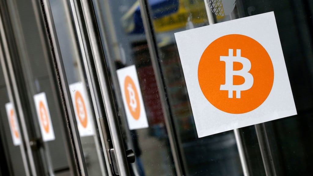 Bitcoin logos: a bitcoin selloff that began at the beginning of the week is gaining momentum, with a quarter of its value evaporating in the past 24 hours. Photograph: Mark Lennihan/AP Photo