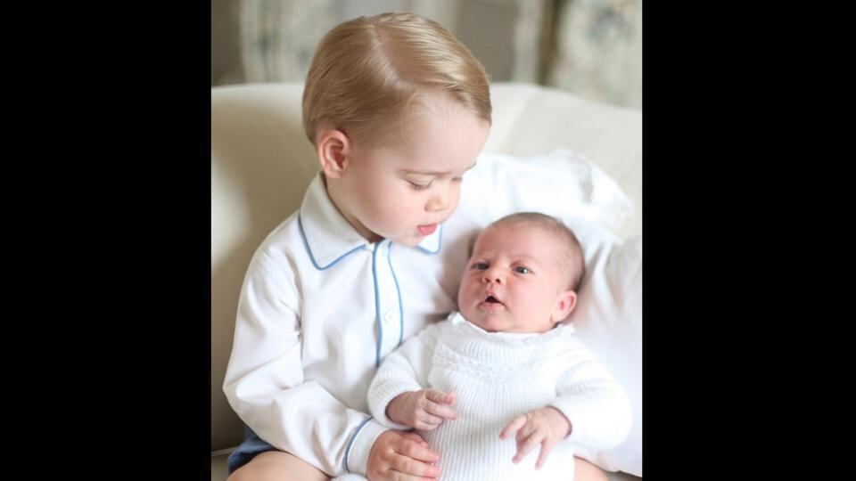Britain’s Princess Charlotte is held by her brother Prince George in a photograph taken by their mother the Duchess of Cambridge in mid-May at Anmer Hall in Norfolk. Photograph: Duchess of Cambridge via PA Wire.