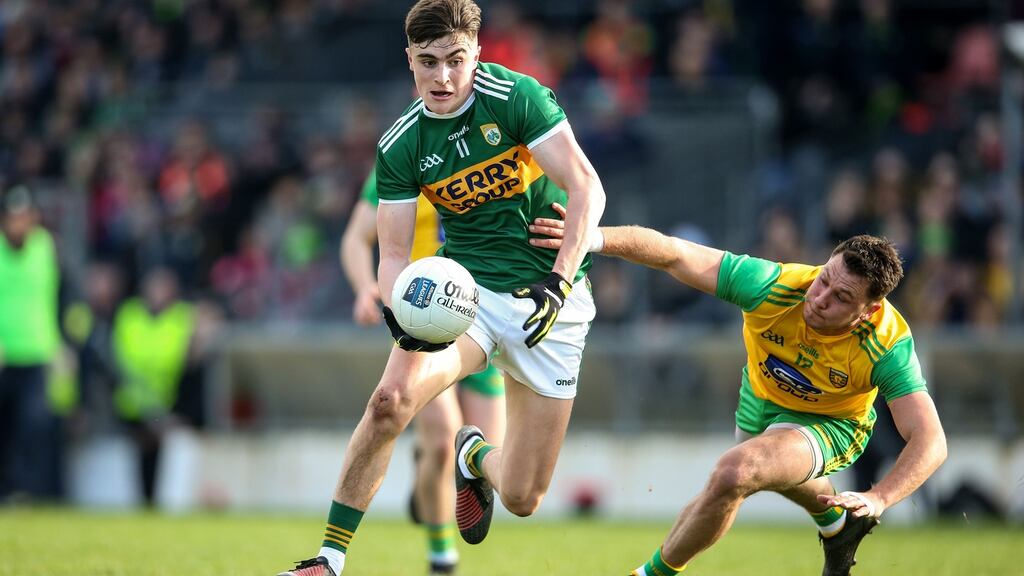 Kerry’s Sean Ó Sé and Paul Brennan of Donegal. The counties meet again at Croke Park next Sunday. PhotographCathal Noonan/Inpho