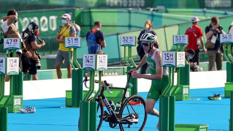 Russell White picks up his bike during the men’s triathlon. Photo: Bryan Keane/Inpho