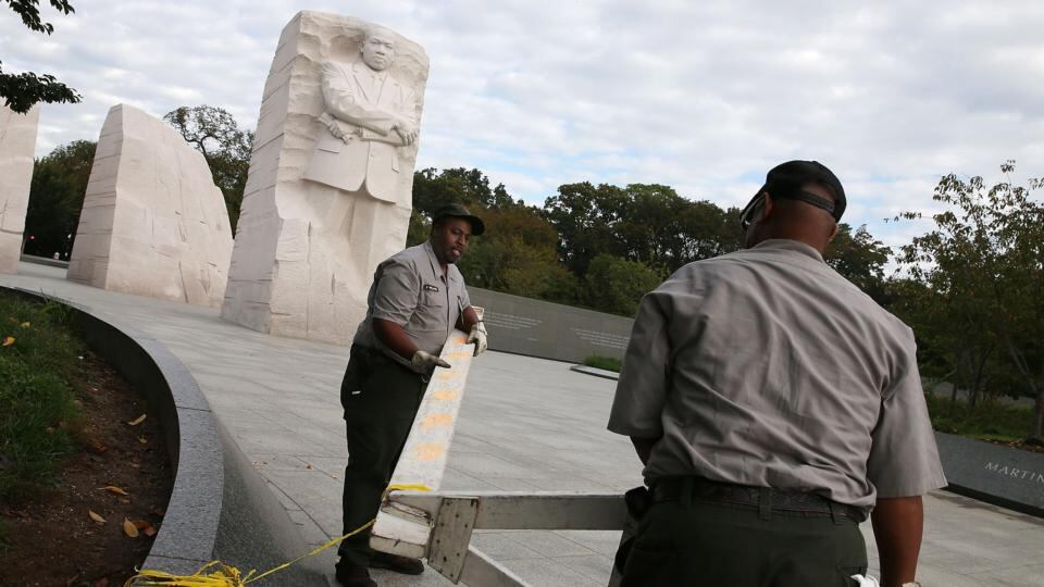 US Park Service workers remove a barricade that was used to close the Martin Luther King Memorial after a bipartisan Bill was passed by the House and the Senate to reopen the government and raise the debt limit. Photograph: Mark Wilson/Getty Images