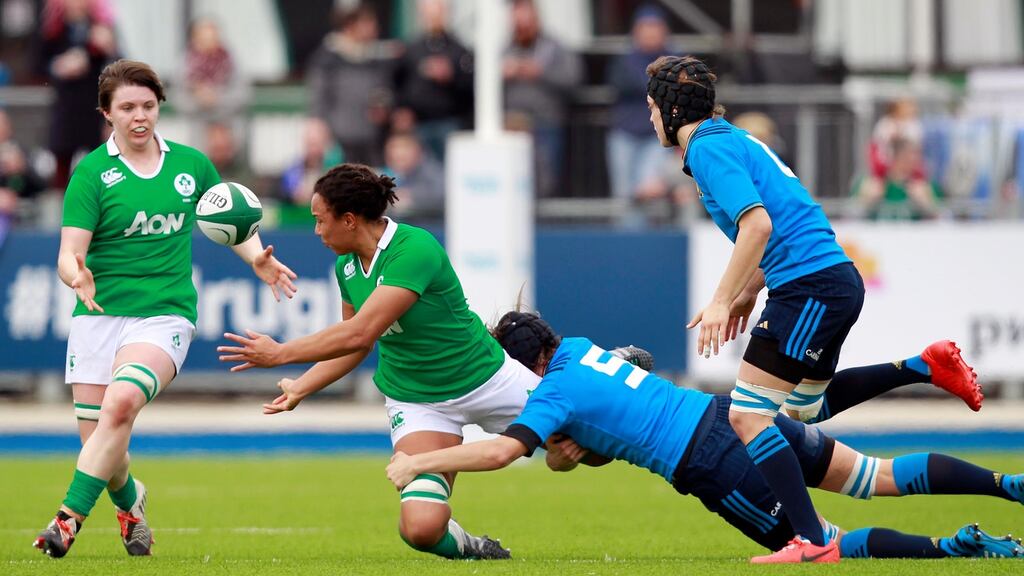 Sophie Spence offloads to Ciara Griffin during Ireland’s win over Italy. Photograph: Inpho