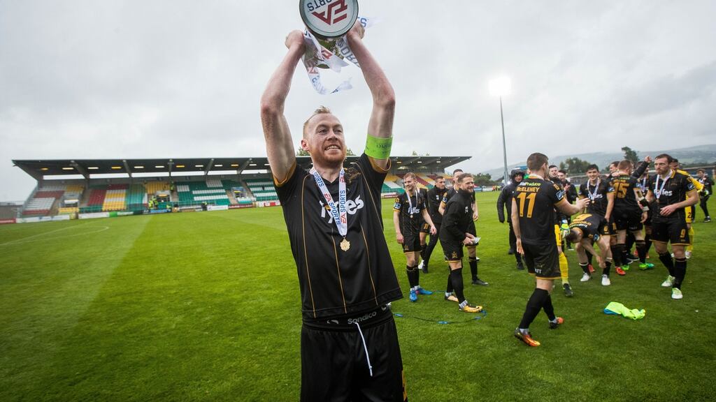 Dundalk’s Chris Shields celebrating with the EA Sports Cup at Tallaght Stadium. Photograph: Ryan Byrne/Inpho