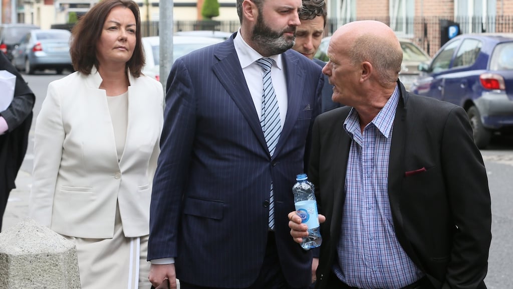 Deirdre Foley, owner of D2 Private is shouted at by former Clery’s worker John Crowe (with water bottle) as she leaves the High Court. D2 Private is part of the Natrium consortium which bought Clerys.   Photograph: Collins