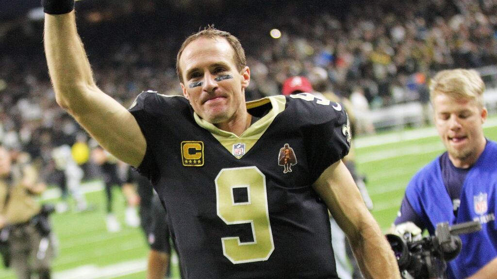 New Orleans Saints quarterback Drew Brees celebrates victory over   Carolina Panthers in the NFL American football NFC wild card playoff game  at the Mercedes-Benz Superdome in New Orleans, Louisiana. Photograph: Dan Anderson/EPA