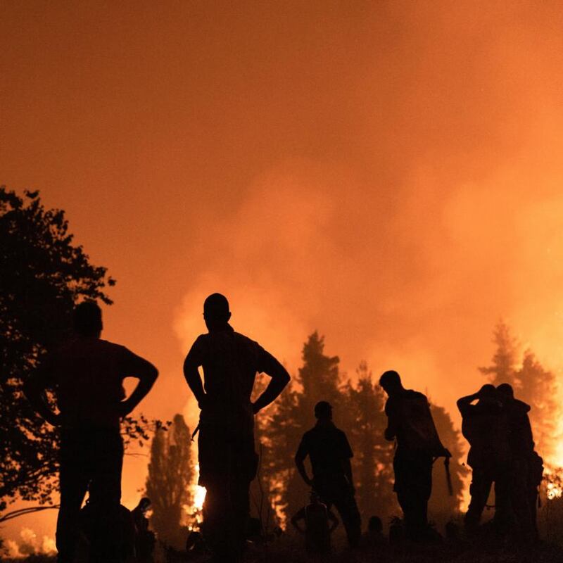 Up in flames: locals watch wildfire on Evia in Greece on Monday. Photograph: Konstantinos Tsakalidis/Bloomberg