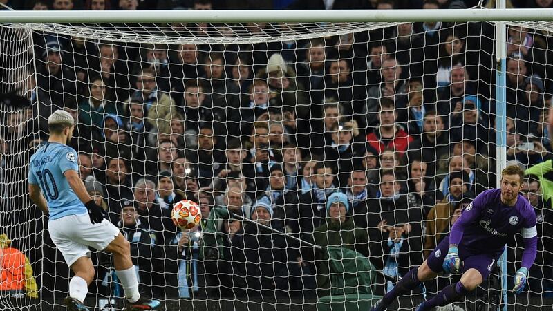 Manchester City’s  Sergio Agüero chips Schalke Ralf Fährmann with a penalty kick  during the Champions League round of 16 second leg match at the Etihad stadium. Photograph: Oli Scarff/AFP/Getty Images