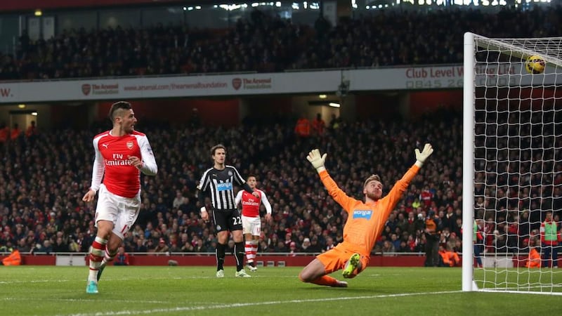 Arsenal’s Olivier Giroud scores their third goal of the game against Newcastle United. Photograph: John Walton/PA Wire