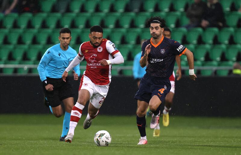 St Patrick's Athletic's Jake Mulraney and Onur Ergun of Istanbul Basaksehir in action at Tallaght Stadium. Photograph: Bryan Keane/Inpho