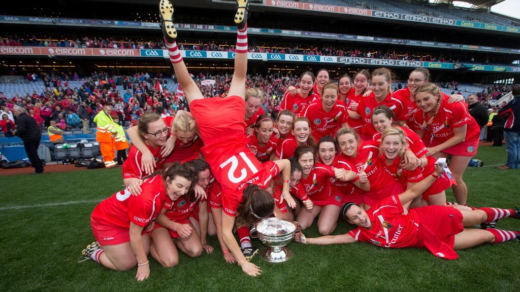 Cork celebrate with the O’Duffy Cup after their victory in 2015. The All-Ireland camogie final has been designated free to air. Photograph: Ryan Byrne/Inpho