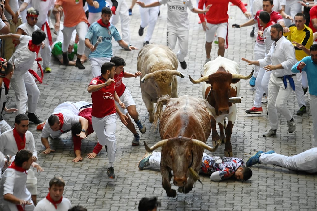 Participants run ahead of Jandilla fighting bulls during the sixth bull run of the San Fermín festival in Pamplona, northern Spain, last July. Photograph: Miguel Riopa/AFP