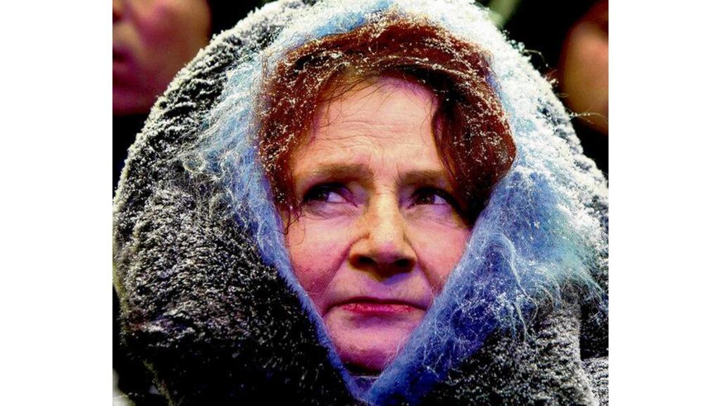 A supporter of Ukrainian opposition leader and presidential candidate Viktor Yanukovich at a campaign rally at the central election commission in Kiev yesterday. Photograph: Alexander Zemlianichenko/AP