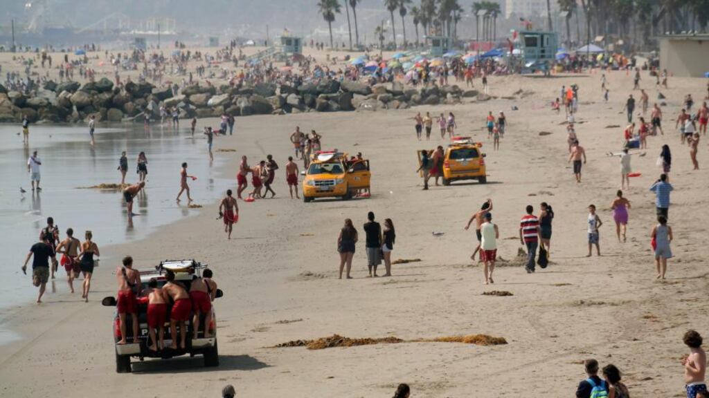 Lifeguards bring ashore the victim of a lightning strike in Venice, California. Lightning from a line of summer thunderstorms moving over the Los Angeles area killed a 20-year-old man and injured 13 other people yesterday, officials said. Photograph: Jonathan Alcorn/Reuters