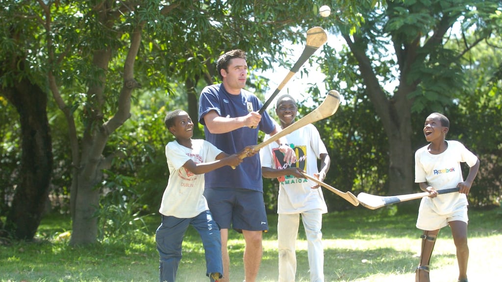 Alan Kerins introducing hurling to local children in Zambia